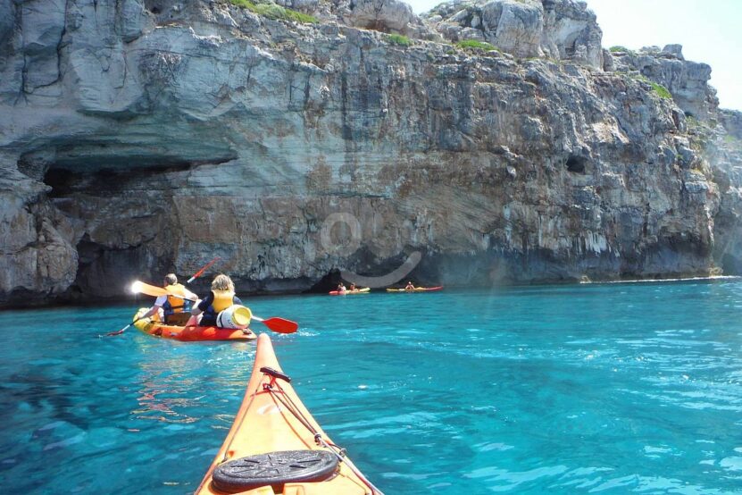 Kayaking in Menorca offers stunning views and unique experiences.